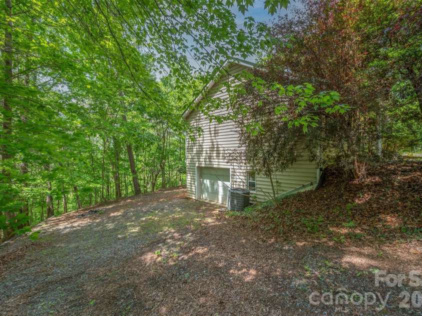 132 Egret Road, Lake Lure, NC 28746.  MLS# CAR4254580, YatesRealty ID 4259. Garage end view