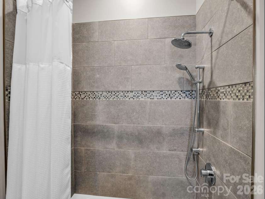 55 Pheasant Branch Court, Hendersonville, NC 28739.  MLS# CAR4406624, YatesRealty ID 42595. Full bathroom on lower level.