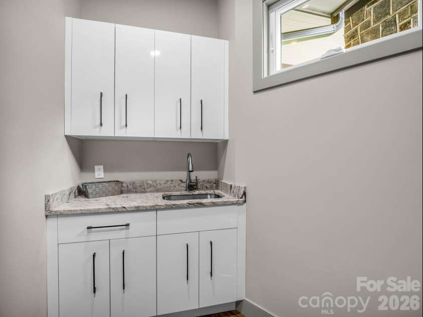 55 Pheasant Branch Court, Hendersonville, NC 28739.  MLS# CAR4406624, YatesRealty ID 42595. Laundry room.