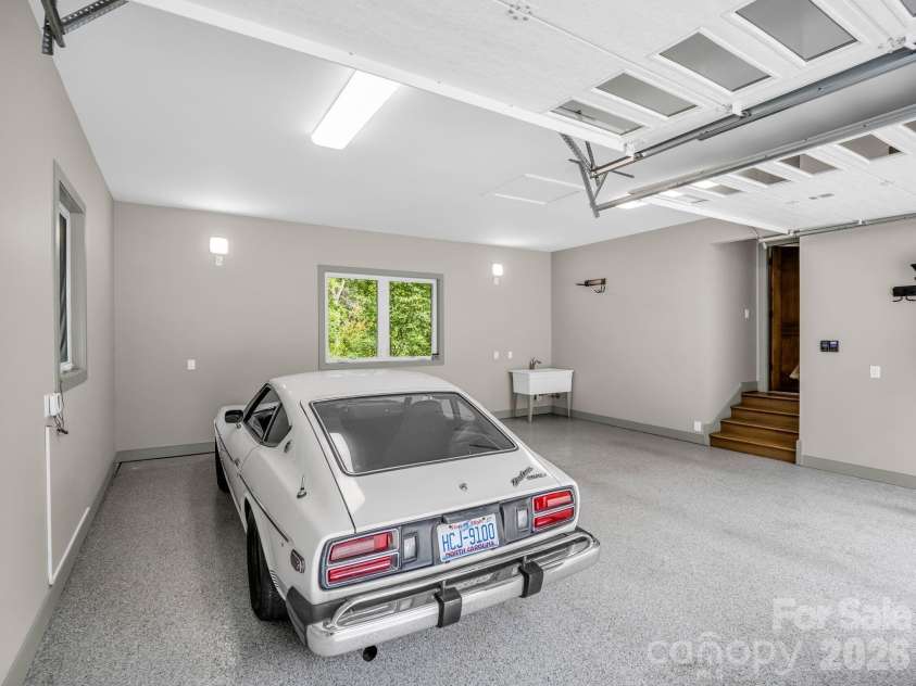 55 Pheasant Branch Court, Hendersonville, NC 28739.  MLS# CAR4406624, YatesRealty ID 42595. Main level, two car garage.