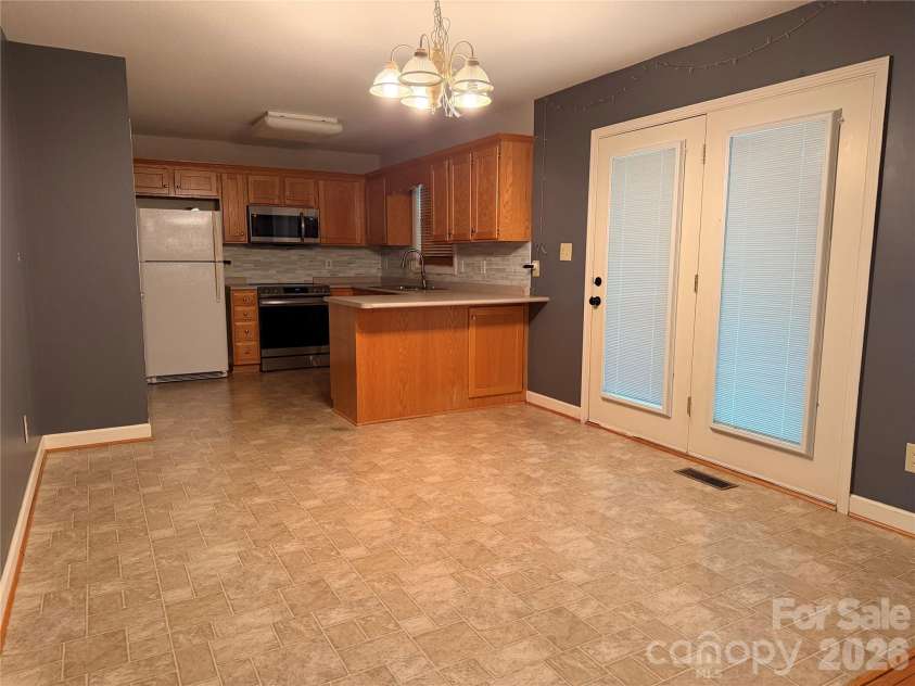 3402 Danial Street, Conover, NC 28613.  MLS# CAR4406576, YatesRealty ID 42603. Kitchen and dining room