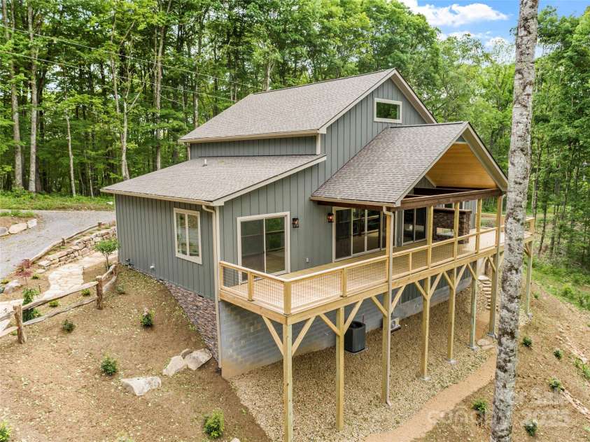 377 Ridge Runner Road, Burnsville, NC 28714.  MLS# CAR4242745, YatesRealty ID 4261. Side view of the cabin