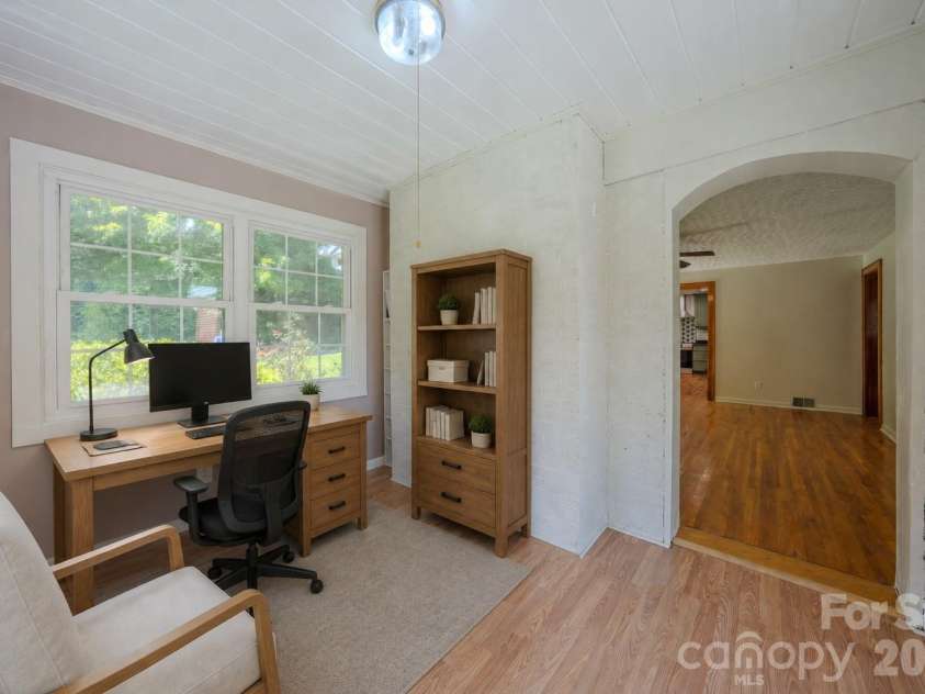 2150 Nc 80 Highway, Bakersville, NC 28705.  MLS# CAR4411879, YatesRealty ID 42615. Virtually staged sunroom as home office