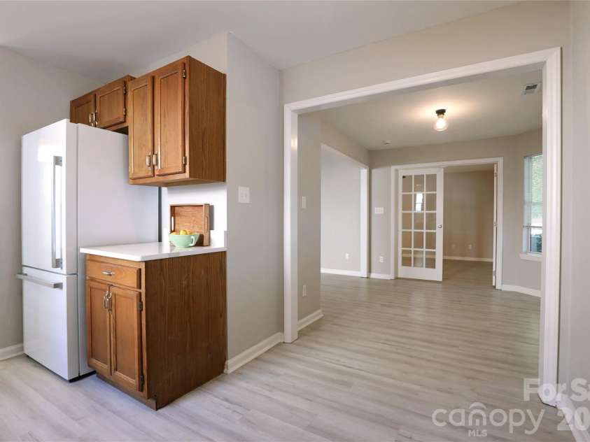 5909 Amity Springs Drive, Charlotte, NC 28212.  MLS# CAR4409733, YatesRealty ID 42616. Views from kitchen into 2nd dining or sitting area.