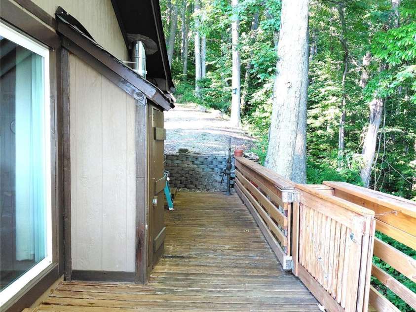 314 Blackberry Lane, Clyde, NC 28721.  MLS# CAR4388492, YatesRealty ID 42632. Side deck