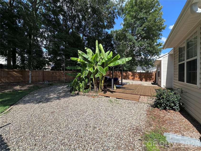 4515 Fox Thorne Drive, Charlotte, NC 28216.  MLS# CAR4411872, YatesRealty ID 42635. Backyard deck and gazebo facing side yard