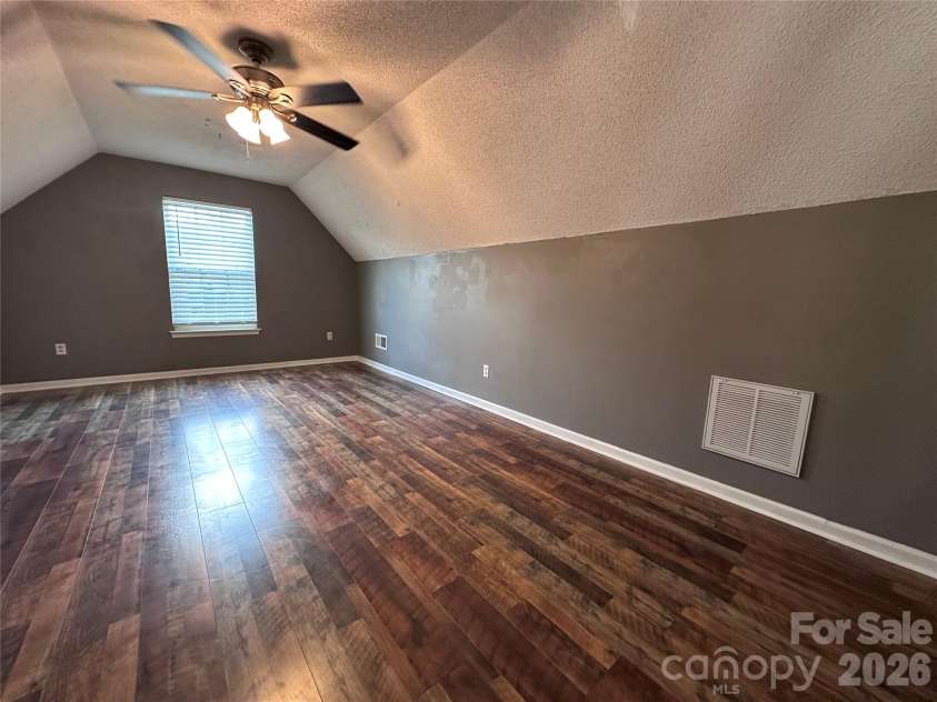 4515 Fox Thorne Drive, Charlotte, NC 28216.  MLS# CAR4411872, YatesRealty ID 42635. Room over garage with ceiling fan
