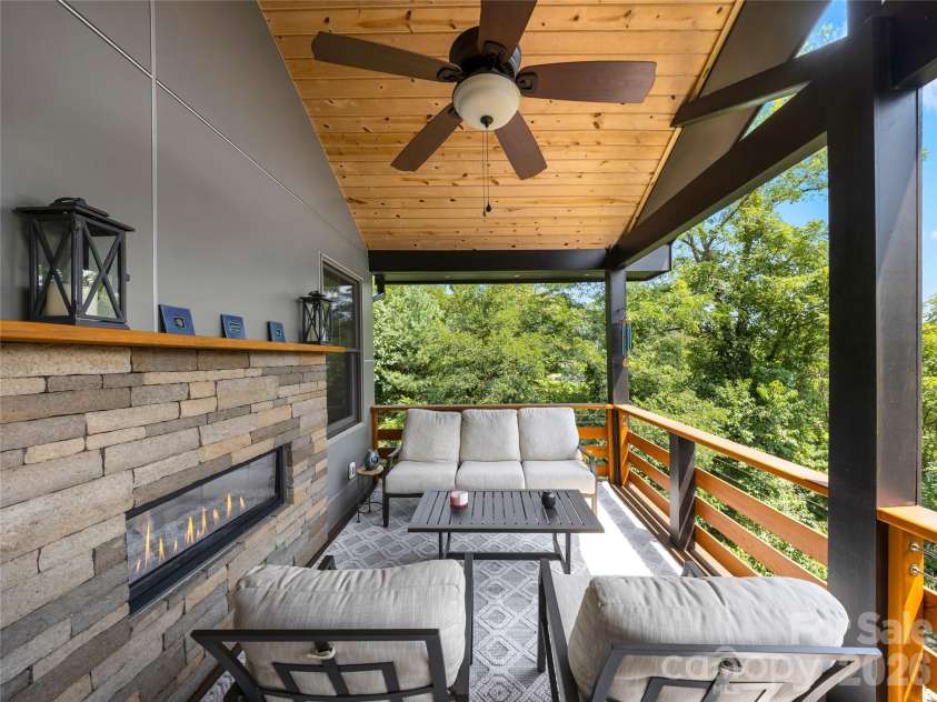 409 Kessler Place, Asheville, NC 28804.  MLS# CAR4410858, YatesRealty ID 42650. Covered Deck with gas fireplace