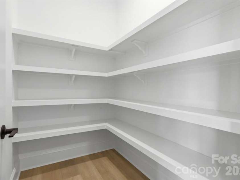 392 NC HWY 200 None, Stanfield, NC 28163.  MLS# CAR4406086, YatesRealty ID 42657. Pantry w/ wood shelving (photo from different Summit model)