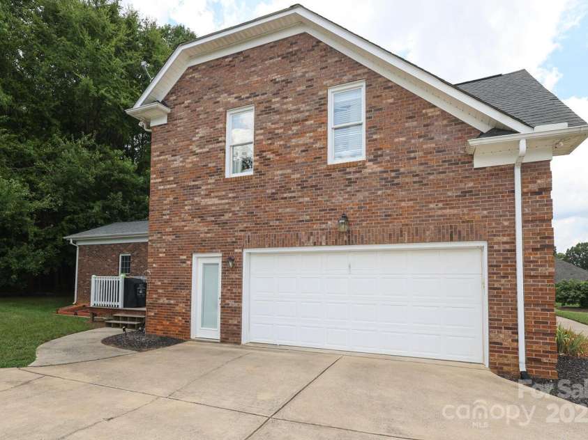3015 Rochester Court, Monroe, NC 28110.  MLS# CAR4275936, YatesRealty ID 4266. Side load Garage