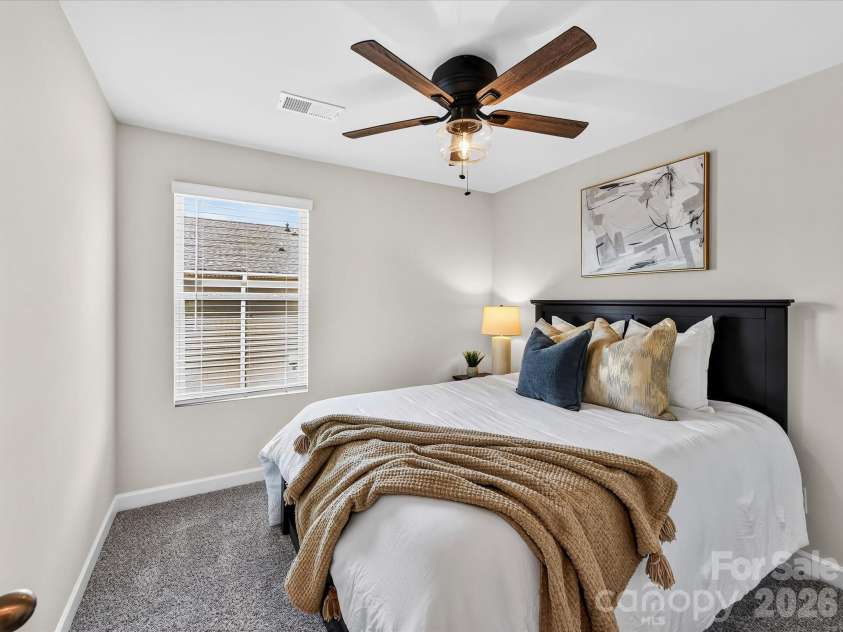 4552 Millennium Avenue, Charlotte, NC 28217.  MLS# CAR4405822, YatesRealty ID 42662. Bright secondary bedroom offers generous closet space and comfortable accommodations for family or guests.