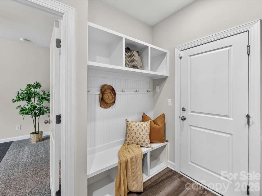 4552 Millennium Avenue, Charlotte, NC 28217.  MLS# CAR4405822, YatesRealty ID 42662. Built-in drop zone with bench seating, storage cubbies, and coat hooks adds everyday organization and convenience.