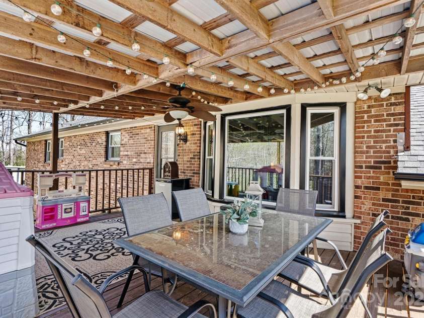 1776 Laurel Hill Drive, Lincolnton, NC 28092.  MLS# CAR4237844, YatesRealty ID 4267. Covered deck main level access from dinning room