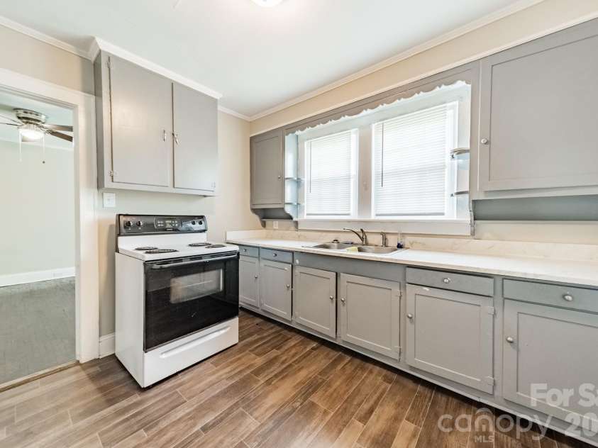 14 Mills Avenue, Concord, NC 28027.  MLS# CAR4403802, YatesRealty ID 42670. Downstairs Kitchen