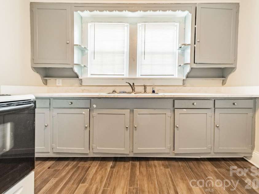 14 Mills Avenue, Concord, NC 28027.  MLS# CAR4403802, YatesRealty ID 42670. Downstairs Kitchen
