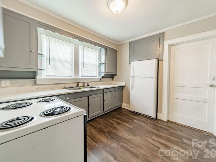 14 Mills Avenue, Concord, NC 28027.  MLS# CAR4403802, YatesRealty ID 42670. Downstairs Kitchen