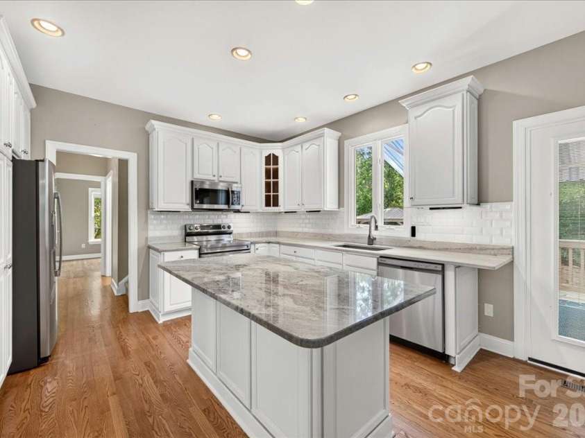 1308 Rockfish Drive, Matthews, NC 28105.  MLS# CAR4403442, YatesRealty ID 42691. Kitchen leads to laundry, garage, and office