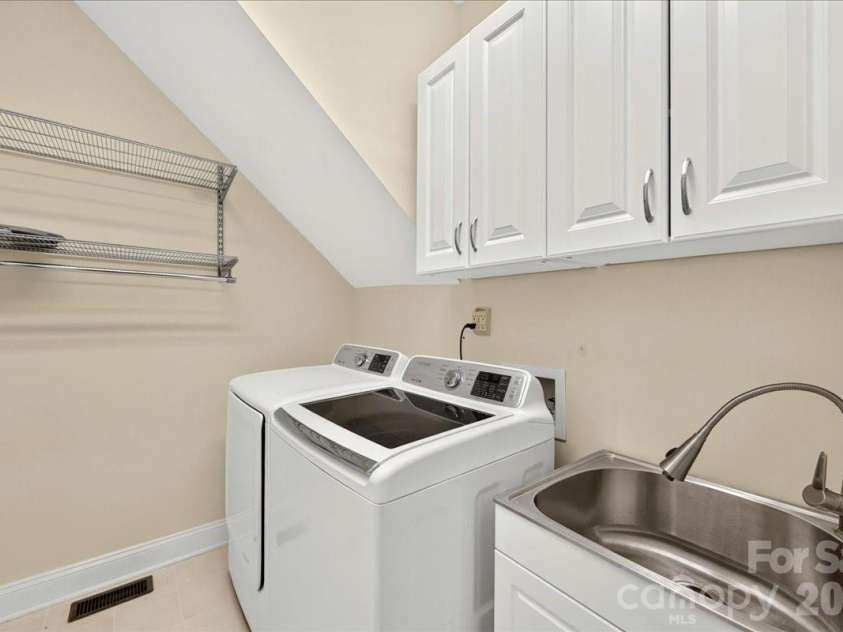 1308 Rockfish Drive, Matthews, NC 28105.  MLS# CAR4403442, YatesRealty ID 42691. Laundry on Main with Utility Sink and Cabinets