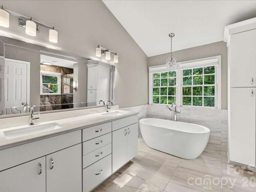 1308 Rockfish Drive, Matthews, NC 28105.  MLS# CAR4403442, YatesRealty ID 42691. Renovated Bathroom with Dual Quartz Vanity