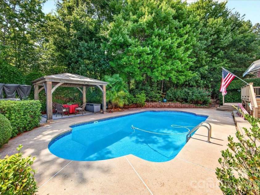 1308 Rockfish Drive, Matthews, NC 28105.  MLS# CAR4403442, YatesRealty ID 42691. Saltwater Pool and Patio