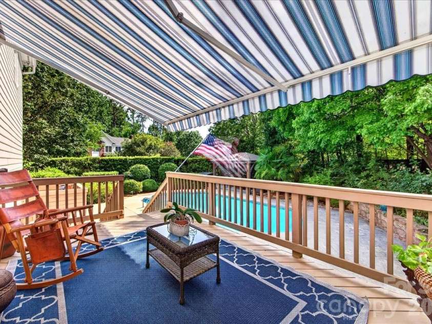 1308 Rockfish Drive, Matthews, NC 28105.  MLS# CAR4403442, YatesRealty ID 42691. Upper level deck with retractable awning