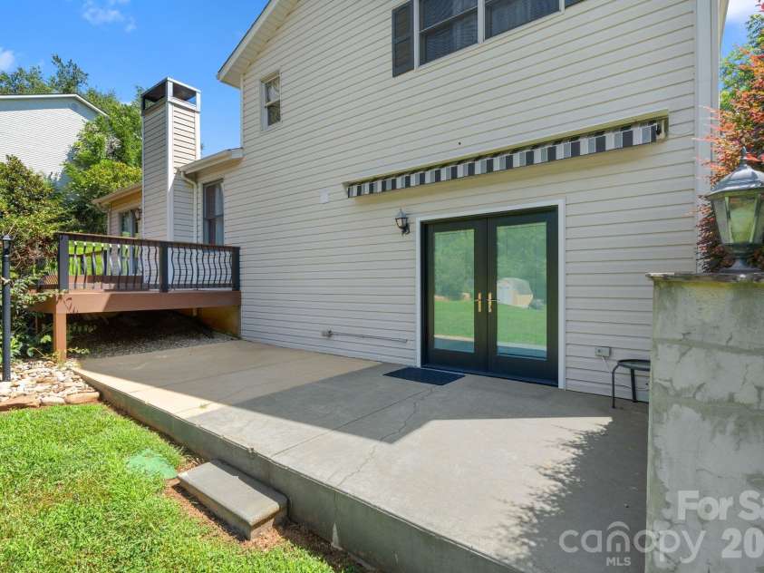 6 Pleasant Run, Asheville, NC 28806.  MLS# CAR4409837, YatesRealty ID 42719. Patio off lower level den.
