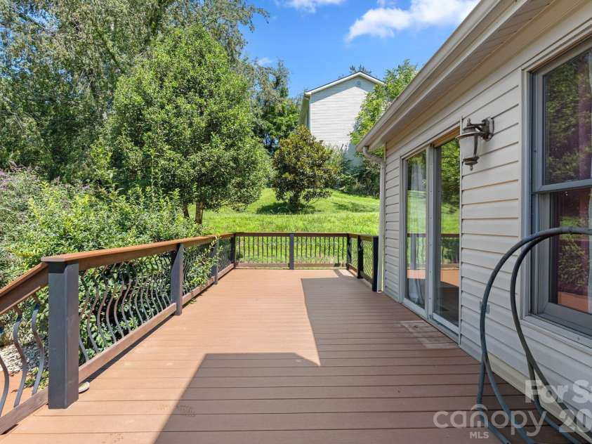 6 Pleasant Run, Asheville, NC 28806.  MLS# CAR4409837, YatesRealty ID 42719. Spacious deck off living room.