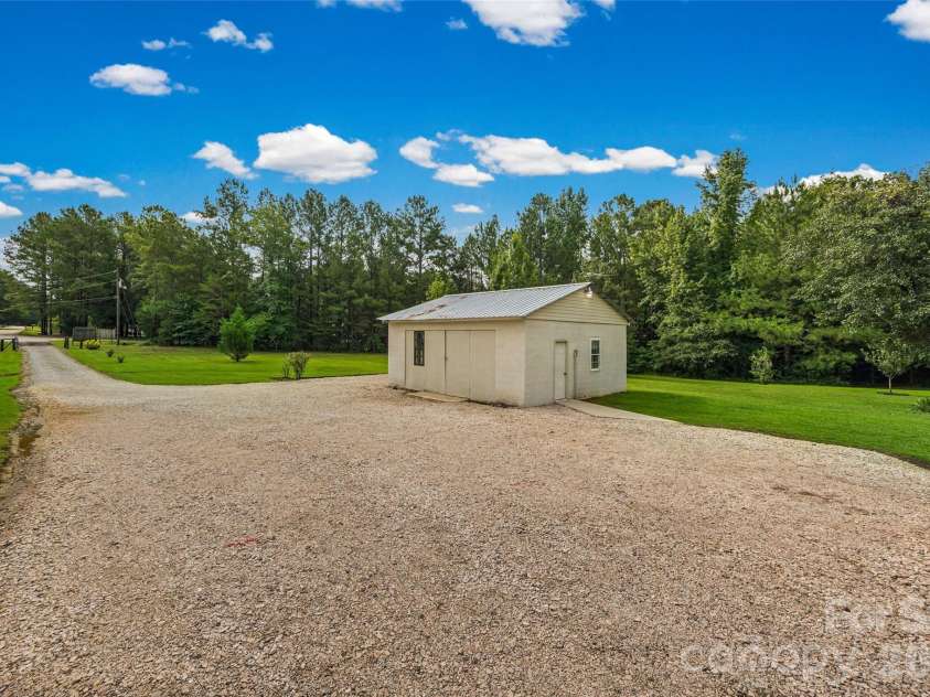 6860 Mandarin Drive, Rock Hill, SC 29732.  MLS# CAR4412258, YatesRealty ID 42721. Concrete Building with mutilple doors