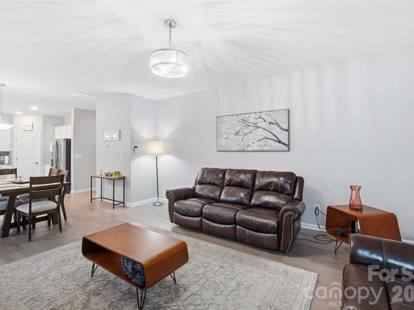 437 Caleb Street, Monroe, NC 28110.  MLS# CAR4407265, YatesRealty ID 42738. Spacious open-concept great room with easy sightlines into the kitchen.
