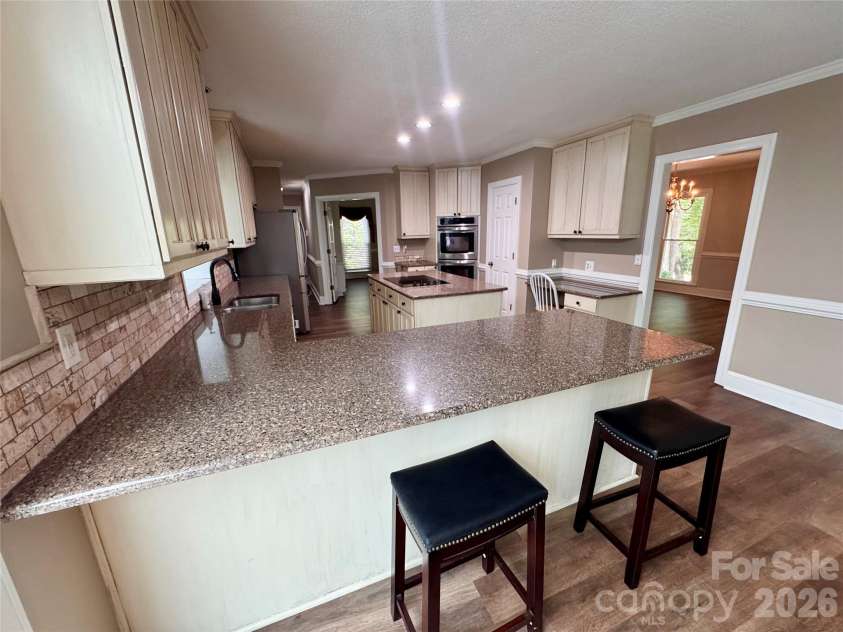 271 Ikerd Drive, Concord, NC 28025.  MLS# CAR4396759, YatesRealty ID 4274. Kitchen-breakfast bar with room for up to 4 bar stools