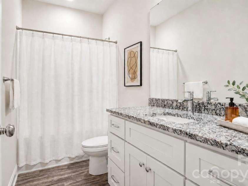 411 Grim Street, Salisbury, NC 28144.  MLS# CAR4404911, YatesRealty ID 42743. Virtually staged primary bath provides a calm, light-filled space to begin and end each day.