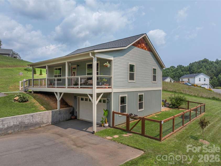 38 Sunrise Drive, Mars Hill, NC 28754.  MLS# CAR4406228, YatesRealty ID 42746. Large wraparound front porch, partially covered