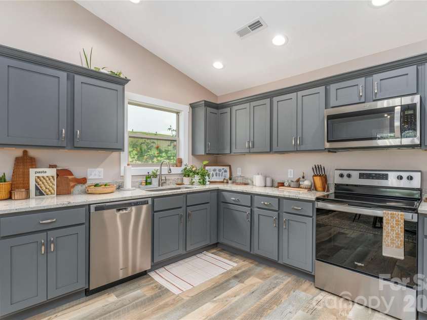 38 Sunrise Drive, Mars Hill, NC 28754.  MLS# CAR4406228, YatesRealty ID 42746. Neutral cedar shake cabinets with brushed nickel hardware