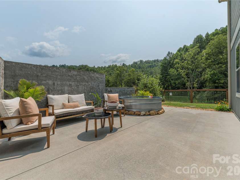 38 Sunrise Drive, Mars Hill, NC 28754.  MLS# CAR4406228, YatesRealty ID 42746. Sunny back patio
