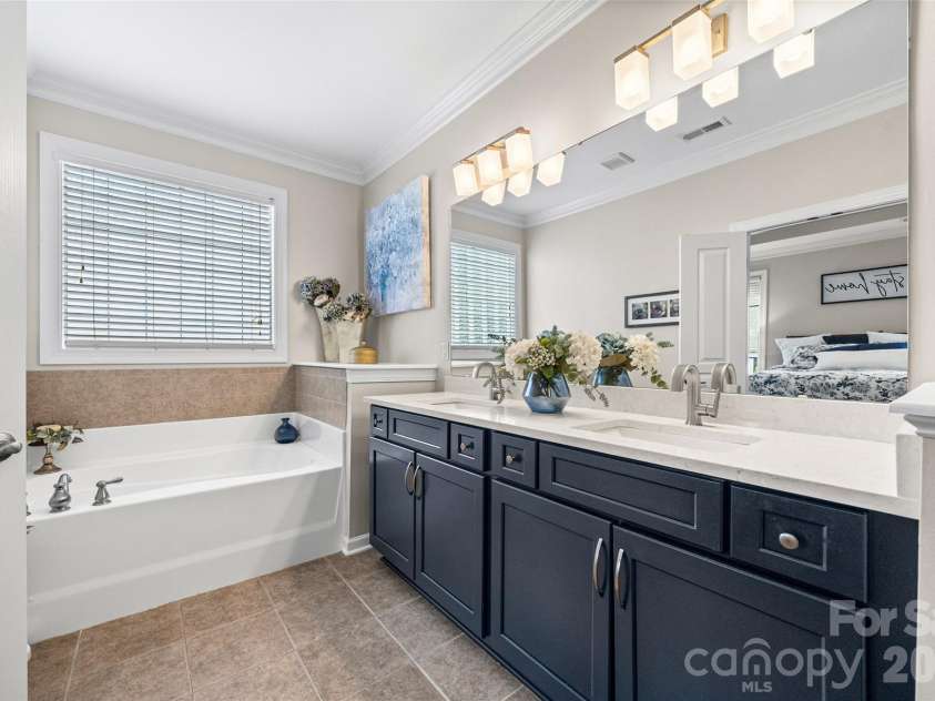 8621 Sequoia Grove Lane, Charlotte, NC 28214.  MLS# CAR4407064, YatesRealty ID 42751. Impressive primary bath with double sinks and soaking tub.