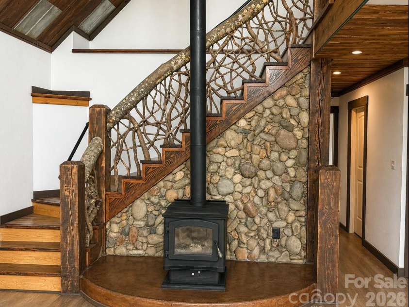 98 Tom Arthur Lane, Leicester, NC 28753.  MLS# CAR4410040, YatesRealty ID 42757. Artisan wall and staircase