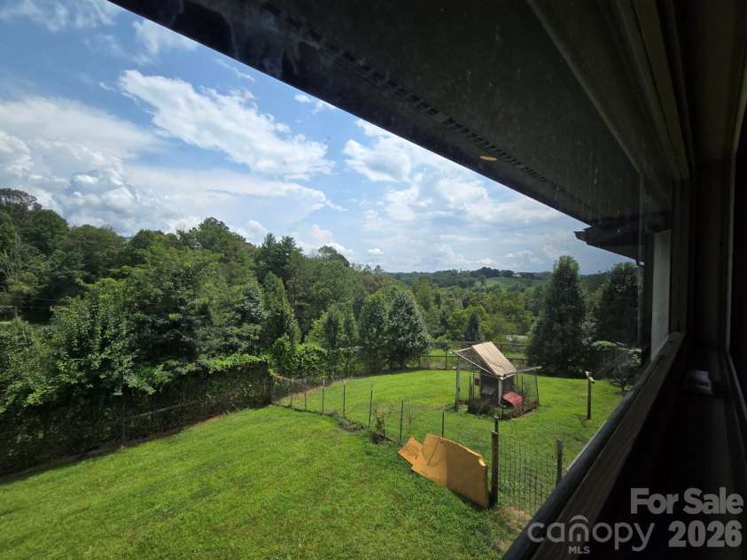 98 Tom Arthur Lane, Leicester, NC 28753.  MLS# CAR4410040, YatesRealty ID 42757. Views from many rooms