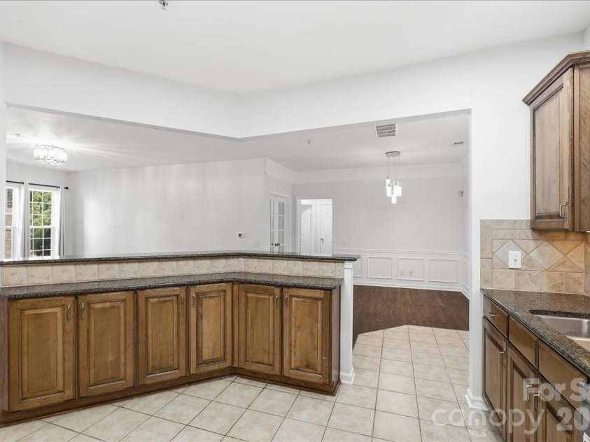 14817 Santa Lucia Drive, Charlotte, NC 28277.  MLS# CAR4412979, YatesRealty ID 42768. TILED KITCHEN FLOOR