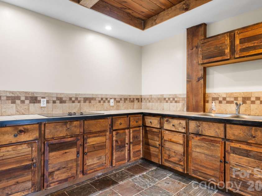 422 Ridge Creek Drive, Taylorsville, NC 28681.  MLS# CAR4425088, YatesRealty ID 42788. Lower Level Kitchenette
