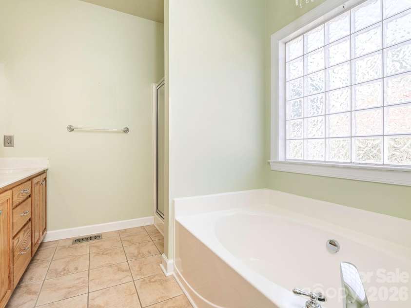 711 Spring Street, Concord, NC 28025.  MLS# CAR4411217, YatesRealty ID 42789. Primary bath