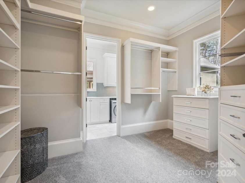 9044 Island Point Road, Charlotte, NC 28278.  MLS# CAR4135509, YatesRealty ID 428. Featuring dual walk-in closets, this suite also boasts a full en-suite laundry, combining convenience with the utmost elegance