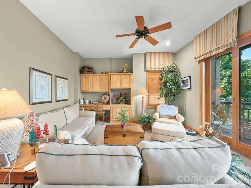81 Stoney Falls Loop, Burnsville, NC 28714.  MLS# CAR4413097, YatesRealty ID 42820. Glass sliders to second deck area
