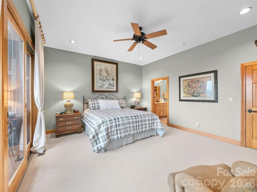 81 Stoney Falls Loop, Burnsville, NC 28714.  MLS# CAR4413097, YatesRealty ID 42820. Primary bedroom with ensuite