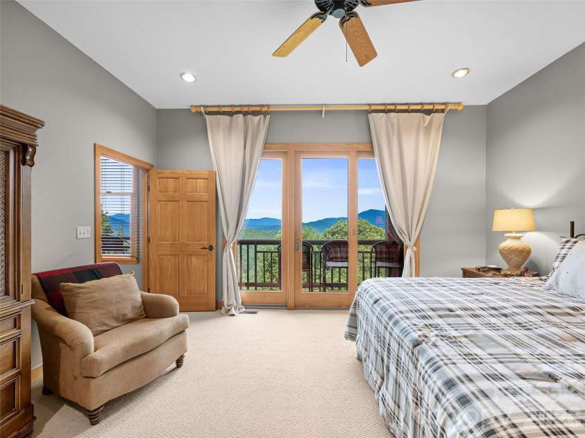 81 Stoney Falls Loop, Burnsville, NC 28714.  MLS# CAR4413097, YatesRealty ID 42820. Primary with deck access and mountain views!