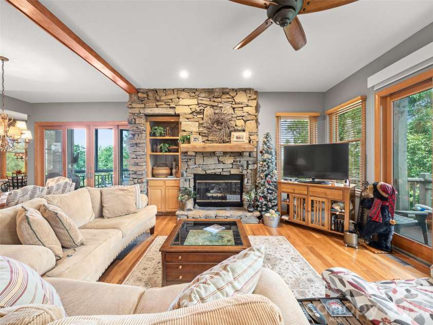 81 Stoney Falls Loop, Burnsville, NC 28714.  MLS# CAR4413097, YatesRealty ID 42820. Stone-stacked fireplace