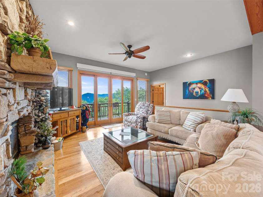 81 Stoney Falls Loop, Burnsville, NC 28714.  MLS# CAR4413097, YatesRealty ID 42820. Wall of windows