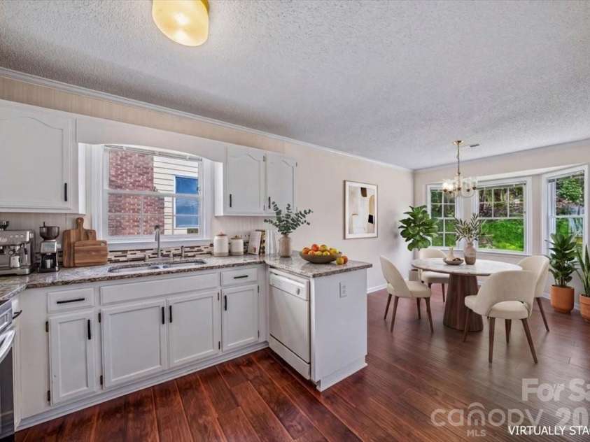 8012 Cadmium Court, Charlotte, NC 28215.  MLS# CAR4413036, YatesRealty ID 42822. Kitchen / dining area virtually staged