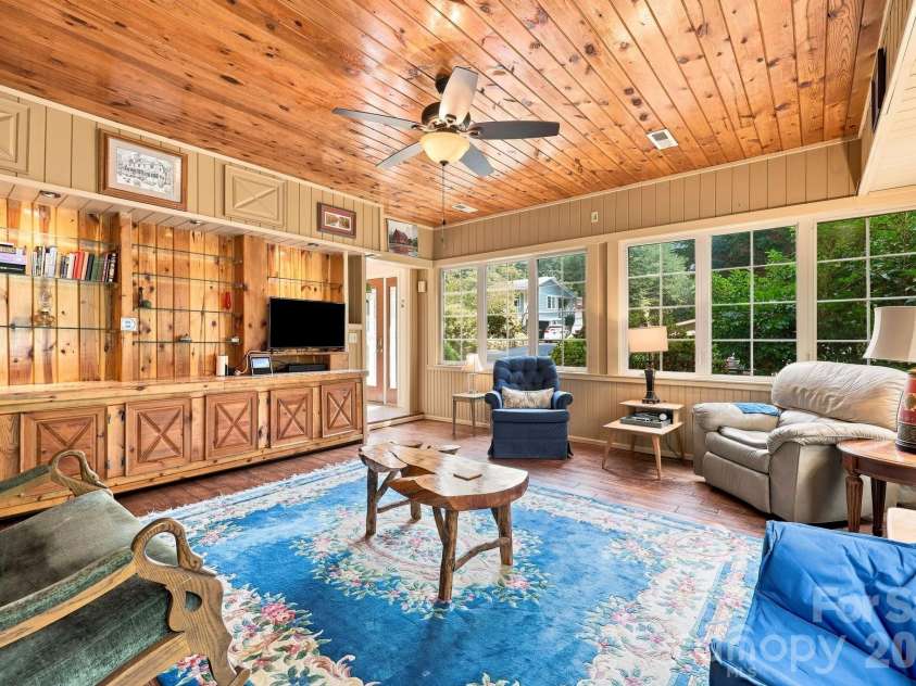 1925 Laurel Park Highway, Hendersonville, NC 28739.  MLS# CAR4410805, YatesRealty ID 42830. What a glorious sunroom!
