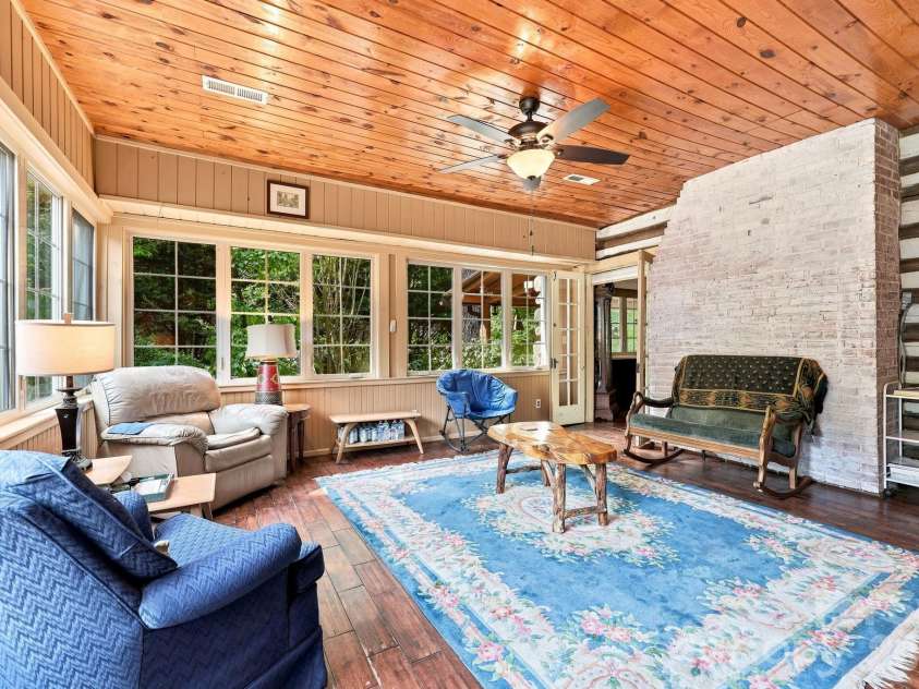 1925 Laurel Park Highway, Hendersonville, NC 28739.  MLS# CAR4410805, YatesRealty ID 42830. What a glorious sunroom!