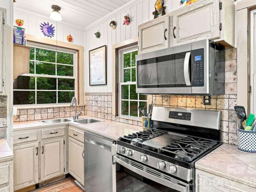 1925 Laurel Park Highway, Hendersonville, NC 28739.  MLS# CAR4410805, YatesRealty ID 42830. Windows let in so much natural light